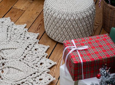 gift boxes beside the crochet carpet