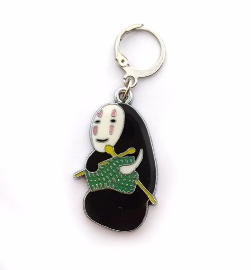 Marqueur de maille Sans visage qui tricote