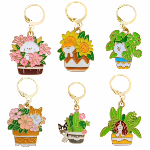 Craque pour les Marqueurs de maille : Les chiens du jardin secret. Une collection de marqueurs crochet et tricot illustrés, mêlant chiens adorables et univers végétal poétique.